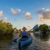 a person in a kayak in a river